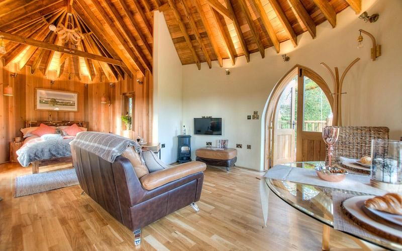 Interior of Trewalter Treehouse with a Hot Tub in Wales