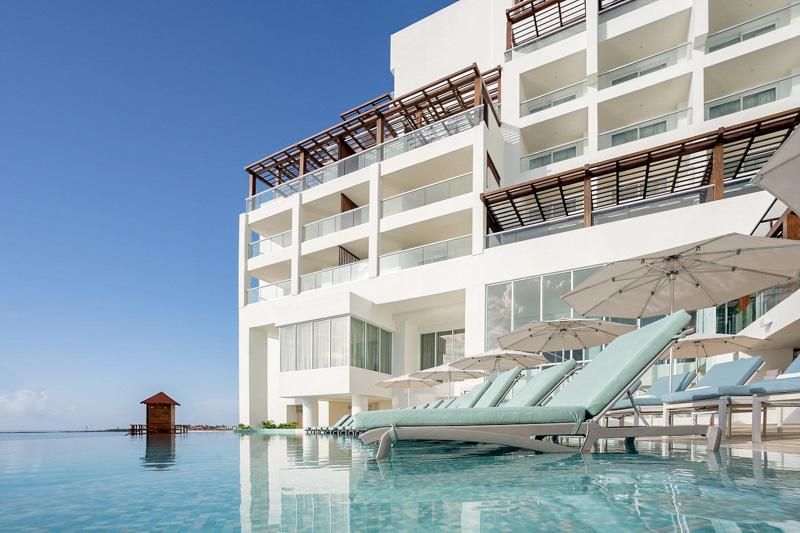 Sun lounges and pool at Sun Palace Cancun, a couples-only all-inclusive resort